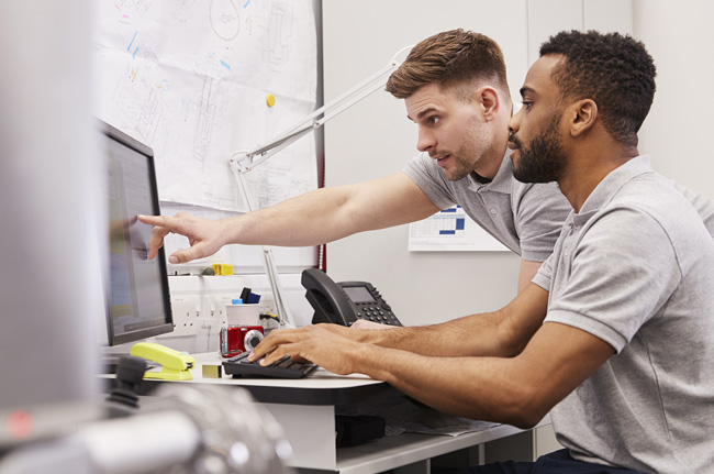 Man helping other staff